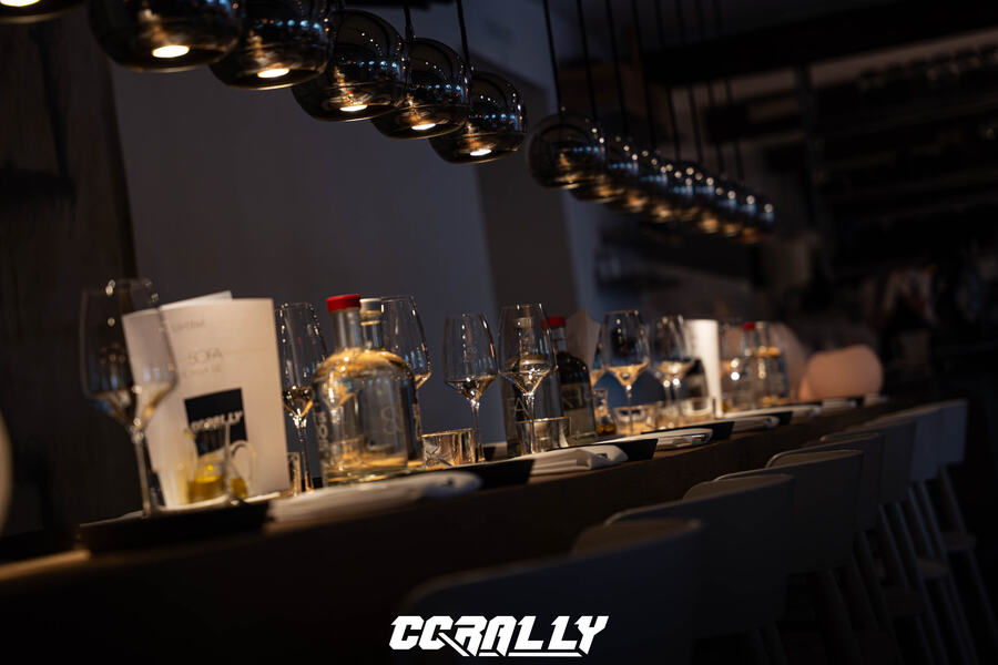 Long table set with wine glasses at a club dinner